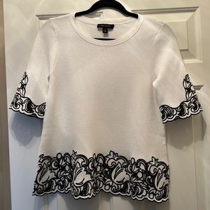 Ann Taylor white knit top with black embroidery. Size small. Practically new.